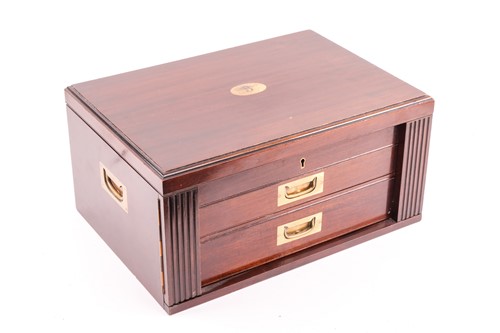 Lot 293 - A two-drawer canteen containing a composite...