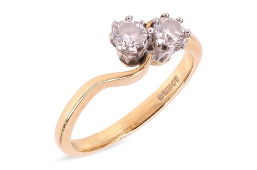 Lot 174 - A diamond-set Toi et Moi ring, with two round...