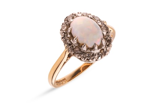 Lot 106 - An opal and diamond cluster ring in 18ct gold,...