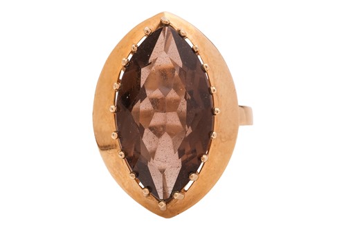 Lot 43 - A smoky quartz dress ring in 9ct gold, size O,...