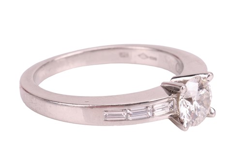 Lot Cartier - A diamond solitaire ring, set with a...