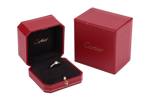 Lot Cartier - A diamond solitaire ring, set with a...