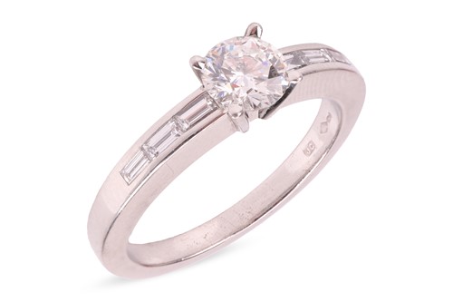Lot Cartier - A diamond solitaire ring, set with a...