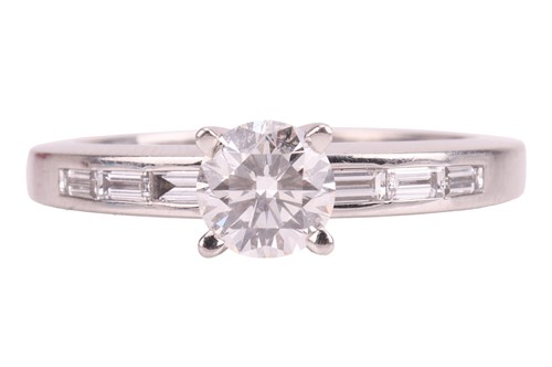 Lot Cartier - A diamond solitaire ring, set with a...