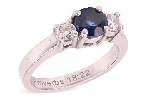Lot 105 - A sapphire and diamond trilogy ring, centred...