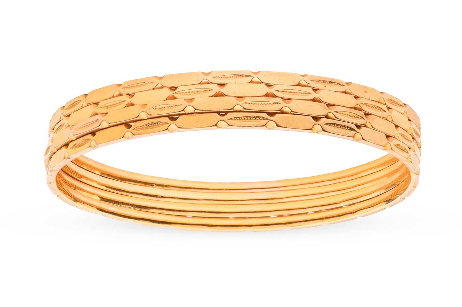 Lot A set of four Indian bangles; each bangle of...