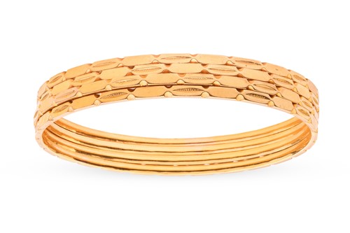 Lot A set of four Indian bangles; each bangle of...