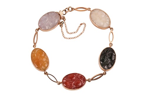 Lot 196 - A multi-coloured carved jade bracelet in 9ct...