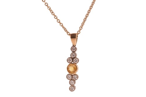 Lot 206 - A yellow sapphire and diamond pendant on chain,...