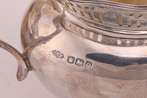 Lot 264 - A George V four-piece silver tea set,...