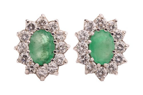 Lot 98 - A pair of emerald-set cluster earrings,...