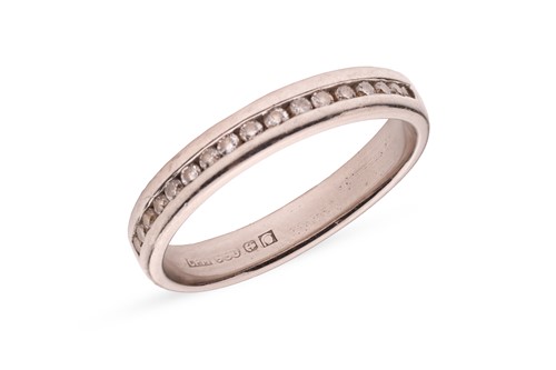 Lot 267 - A diamond-set half eternity ring in palladium,...