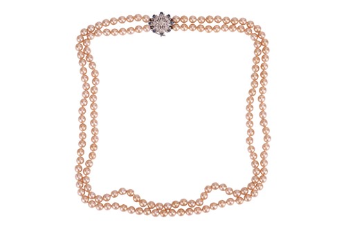 Lot 108 - An imitation pearl double-strand necklace,...