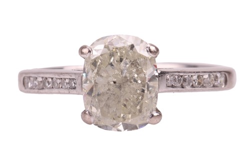 Lot A diamond solitaire ring in 18ct white gold,...