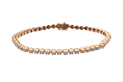 Lot 220 - A diamond line bracelet, comprising fifty...