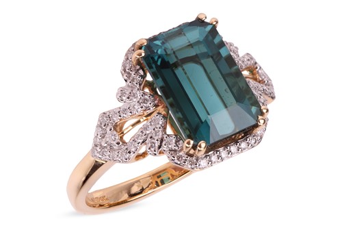 Lot 143 - A tourmaline and diamond dress ring in 18ct...