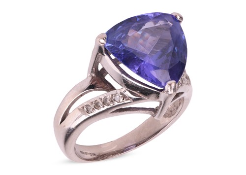 Lot 263 - A tanzanite dress ring, claw-set with a...