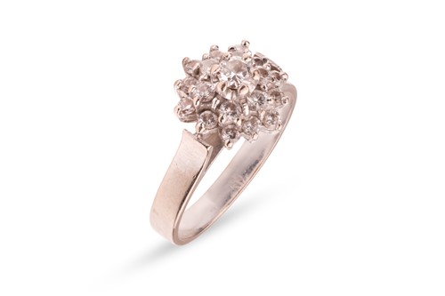 Lot 189 - A diamond floral cluster ring, with an...