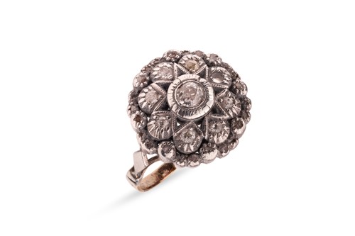Lot 120 - A diamond cluster ring, of starburst design,...