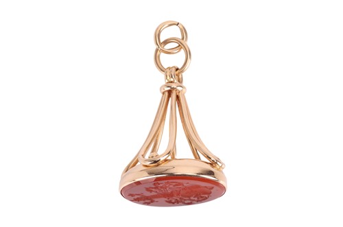 Lot 27 - A carnelian fob seal, the oval panel engraved...