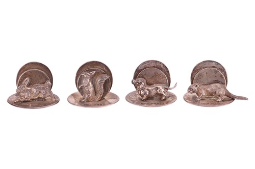 Lot 316 - A set of four novelty silver menu holders,...
