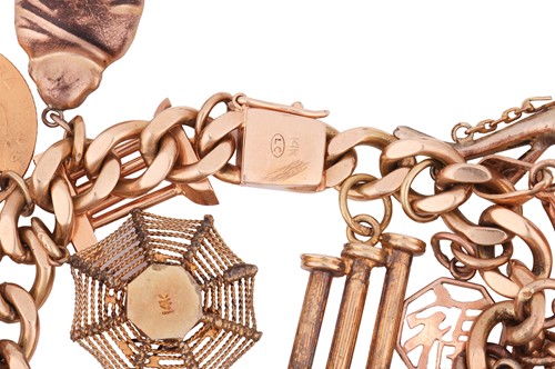 Lot 35 - A charm bracelet, the flat-curb link chain,...