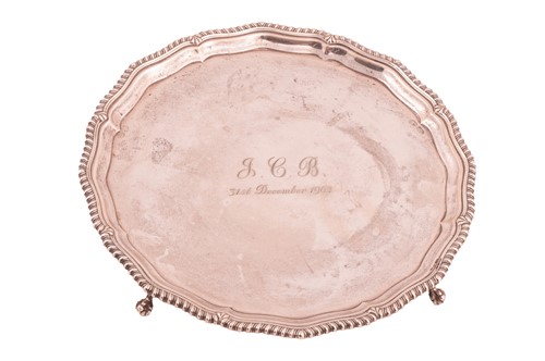 Lot 325 - A silver salver, circular with a raised...