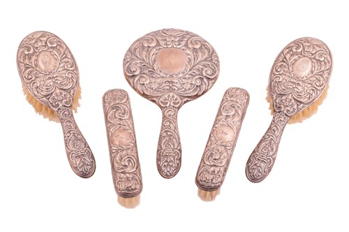 Lot 154 - A silver-mounted five-piece dressing table set,...