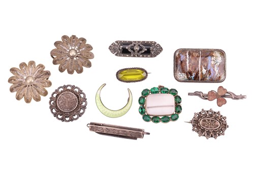 Lot 115 - A small collection of white metal brooches; to...