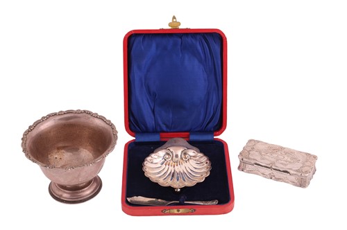 Lot 149 - A silver sugar bowl with a floral border, on a...