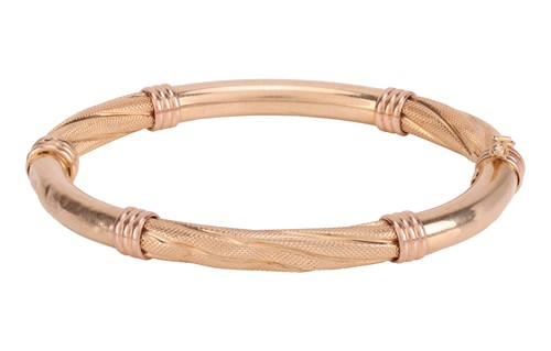 Lot 205 - A hollow hinged bangle, composed of six...