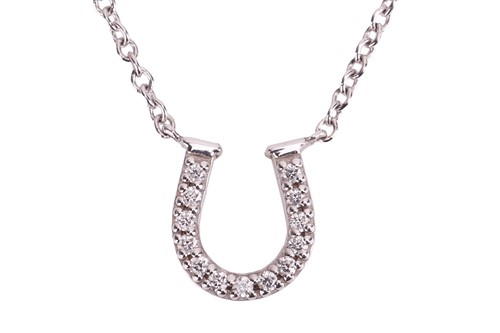 Lot 253 - Tiffany & Co. - a mini diamond-set horseshoe...
