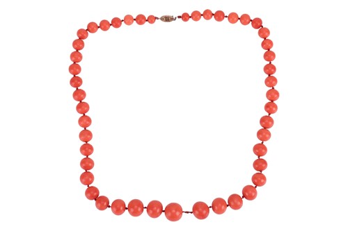 Lot 31 - A coral bead necklace, comprising a series of...