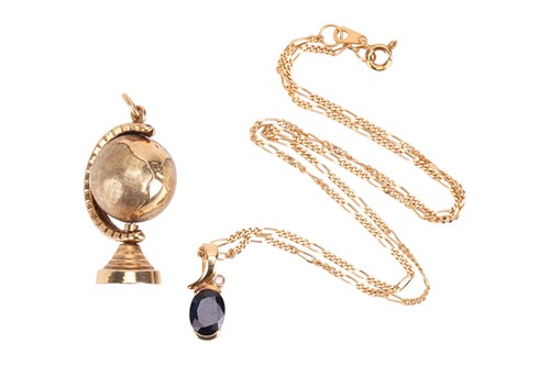 Lot 35 - A sapphire and diamond pendant in yellow metal...