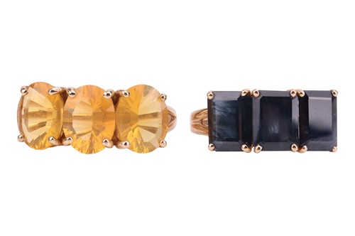 Lot 6 - A pair of gem-set rings, the first claw-set...