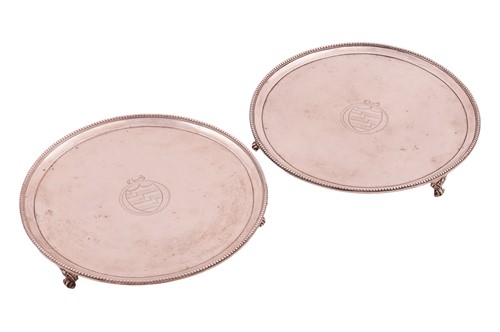 Lot 345 - A pair of George III silver salvers. Circular...