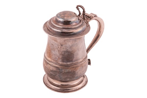 Lot 337 - A George III lidded tankard, baluster form...