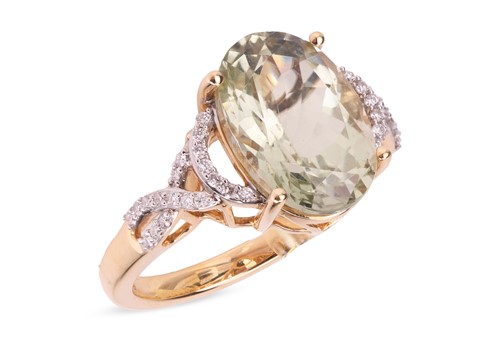 Lot 40 - A tourmaline and diamond dress ring in 18ct...