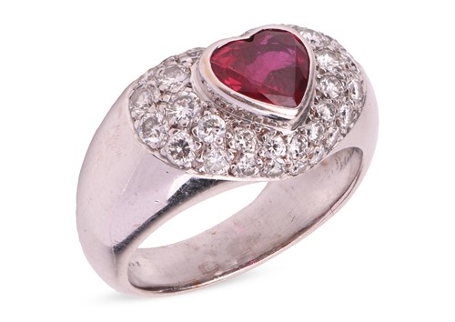 Lot 135 - A ruby and diamond dress ring, centred with a...