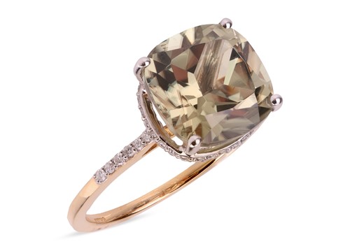 Lot 202 - A gem-set dress ring in 18ct gold, claw-set...