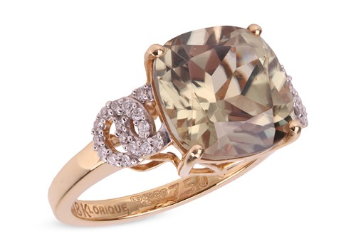Lot 206 - A gem-set dress ring in 18ct gold, featuring a...