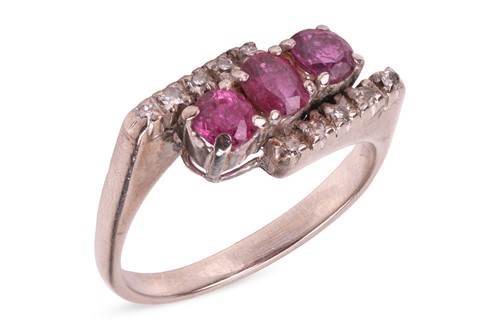 Lot 127 - A ruby and diamond crossover ring, comprising...