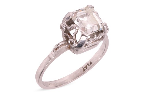 Lot 230 - An emerald-cut diamond ring, the diamond...