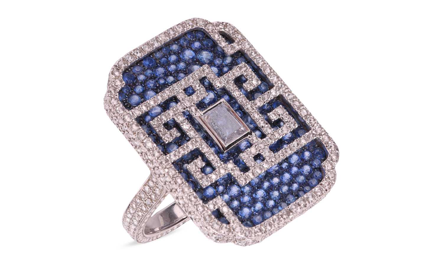 Lot 155 - A diamond and sapphire cocktail ring, by...