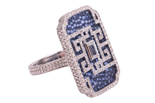 Lot 155 - A diamond and sapphire cocktail ring, by...