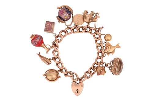 Lot 37 - A charm bracelet, comprising a series of...