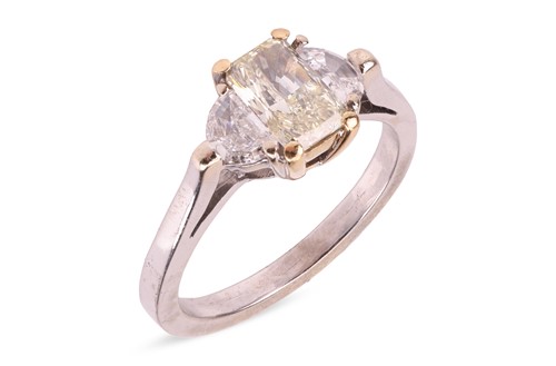 Lot A three-stone diamond ring centred with a...