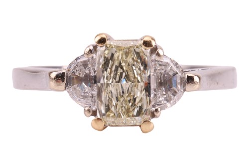 Lot A three-stone diamond ring centred with a...