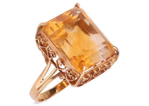 Lot 104 - A citrine dress ring, claw-set with a step-cut...