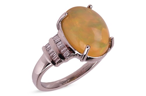 Lot 219 - A fire opal and diamond dress ring in platinum,...